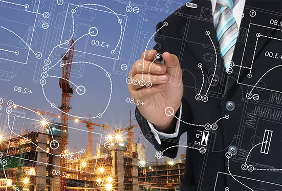 Businessman in suit draws a white work plan, behind him a construction site is created.